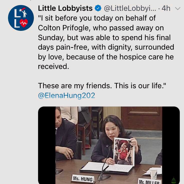 A founder of Little Lobbyists holds up a photo of a child who has recently died, while explaining that our families need health care.