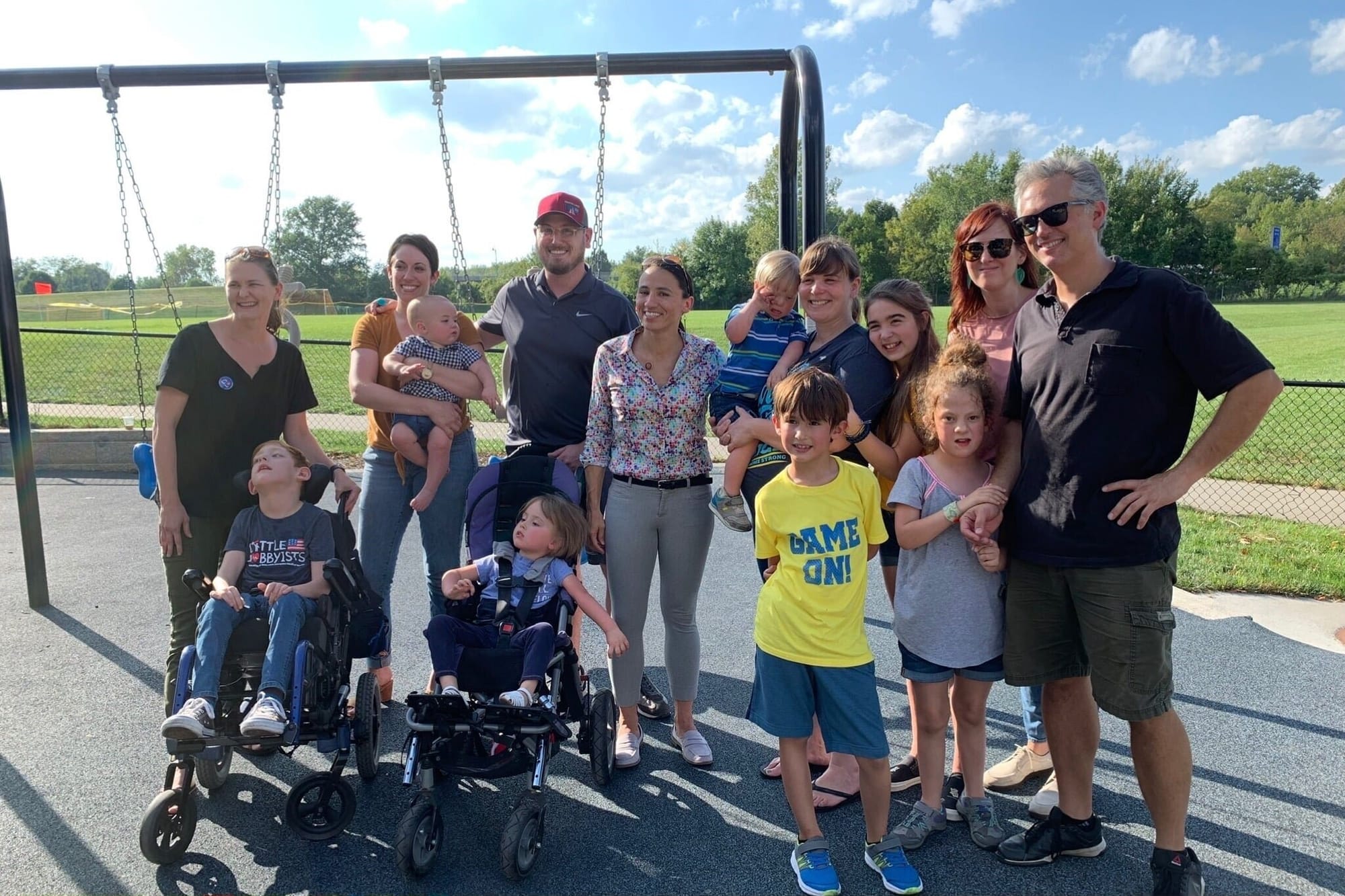 Member of Congress at a local playground with Little Lobbyists families.