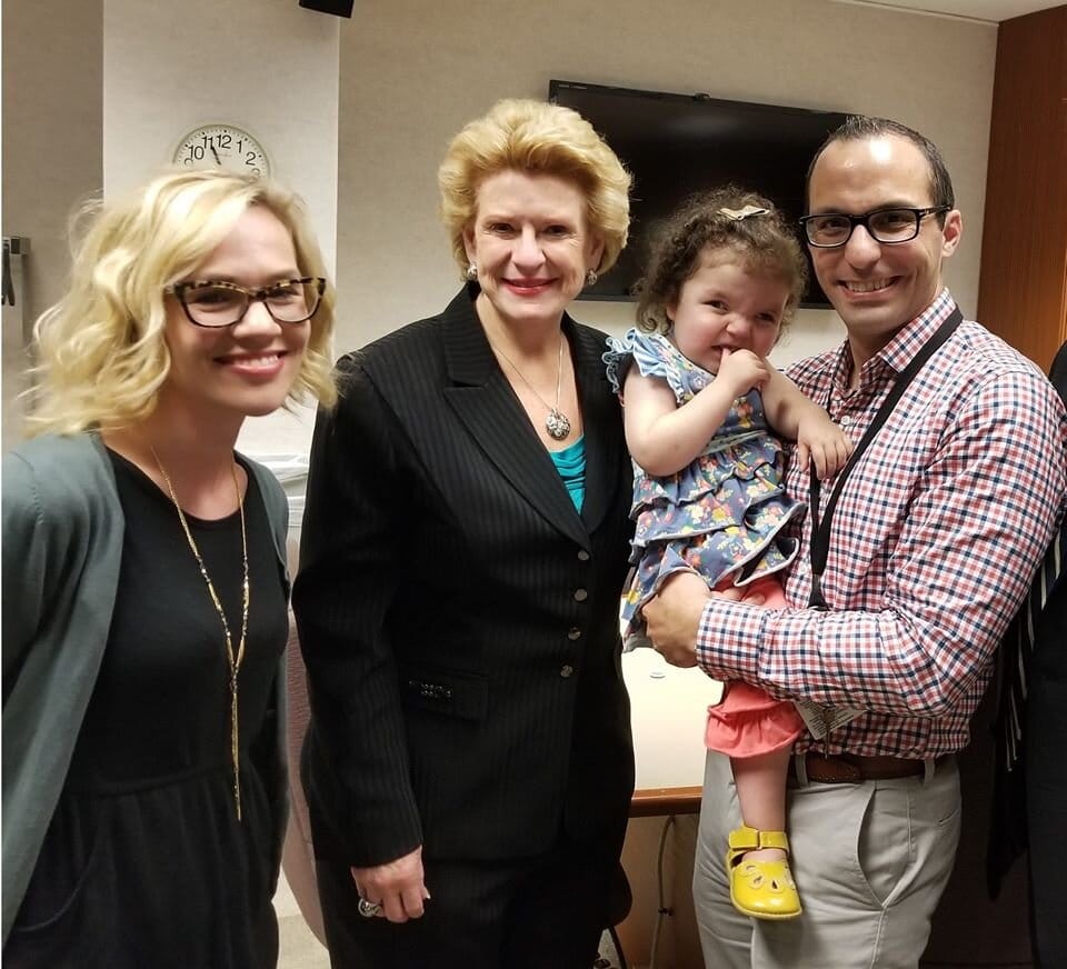 Andrea her daughter Louisa and her husband Tom with Senator Stabenow.