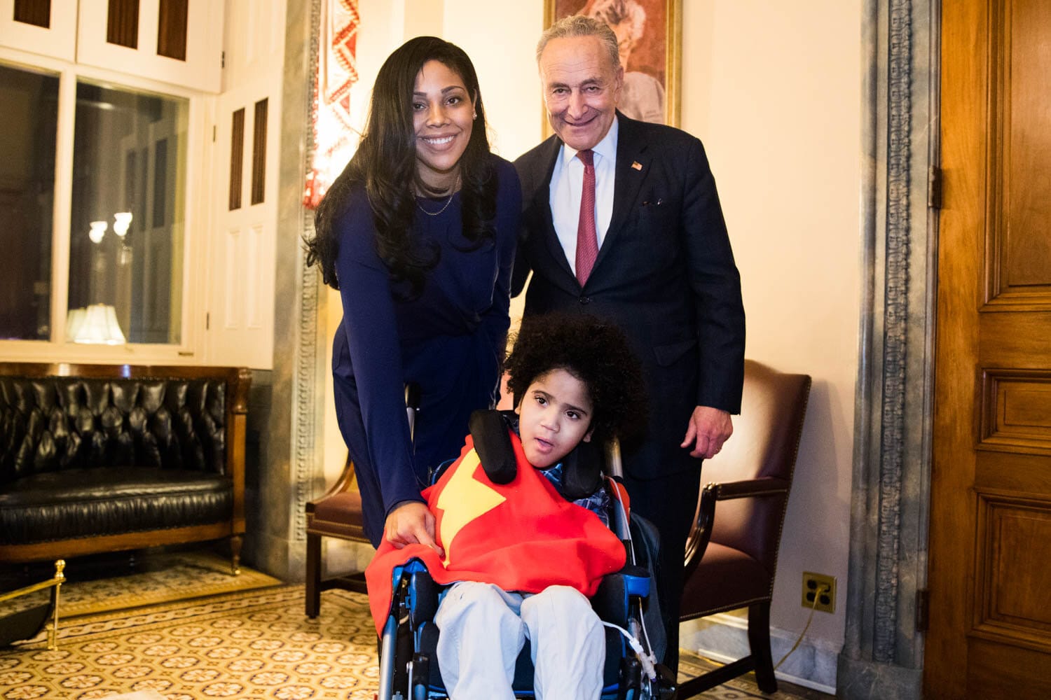 Leslie with her son Jonathan and Senator Schumer