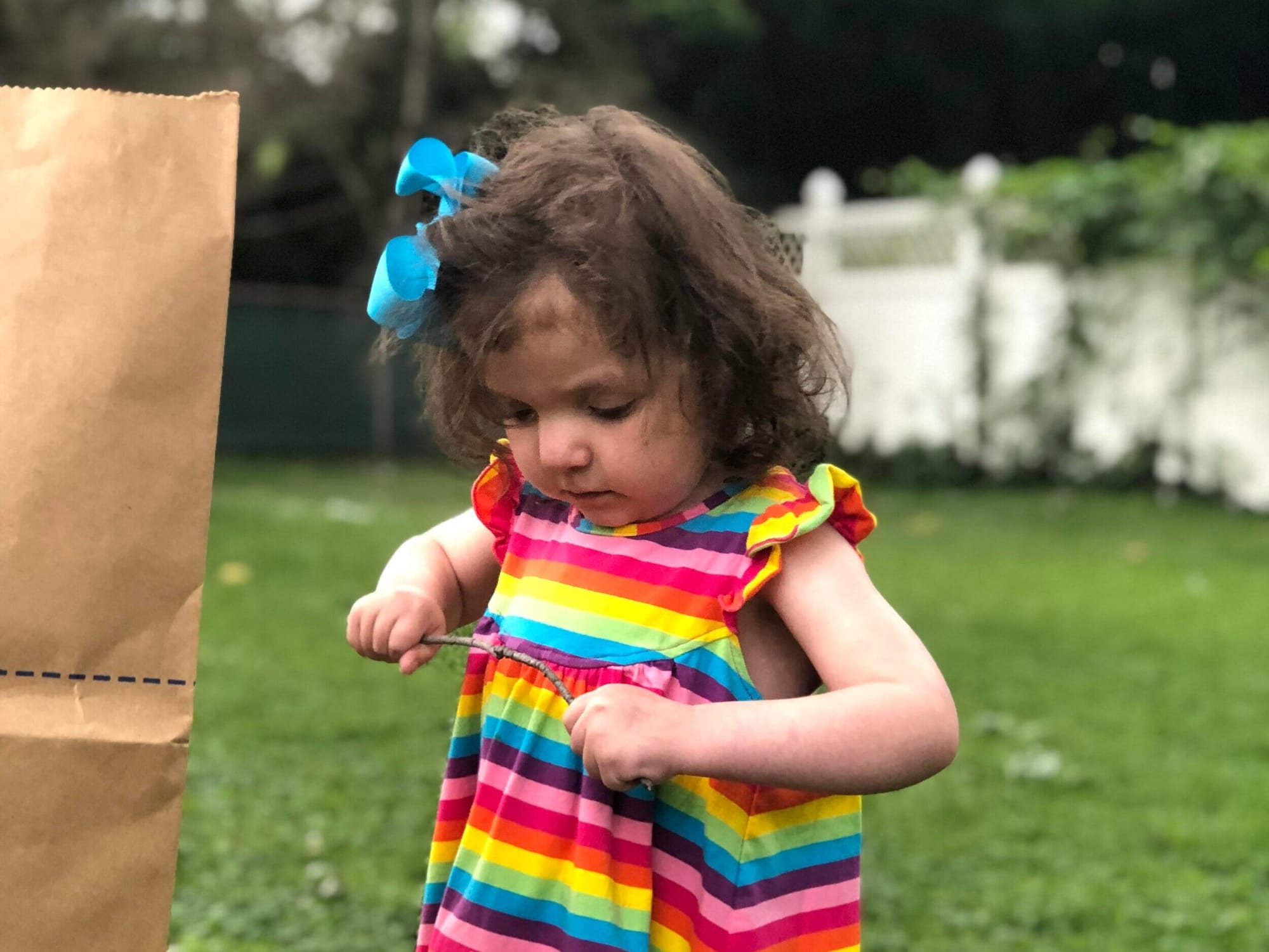 Louisa helping her family with yard work.