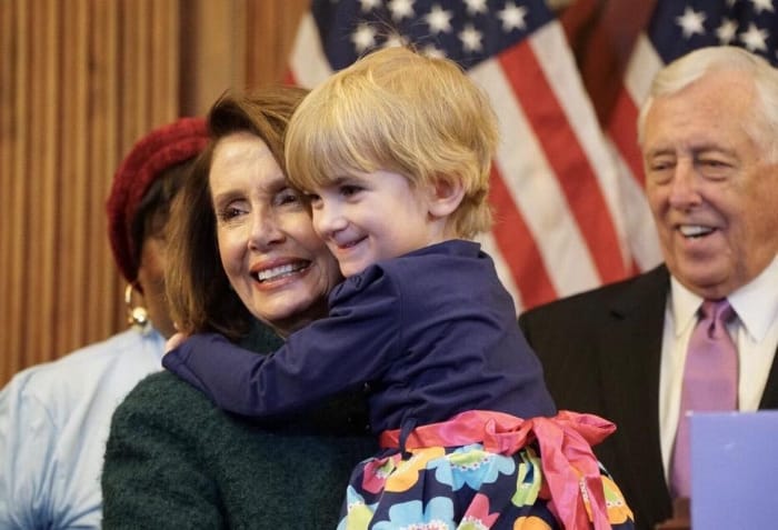 Leader Pelosi getting a hug from Little Lobbyist Charlie. No, our kids could not be any cuter.