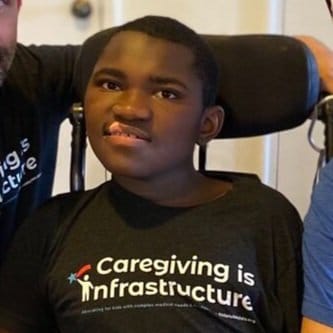 Ravi an African American teenager wearing a little lobbyists shirt