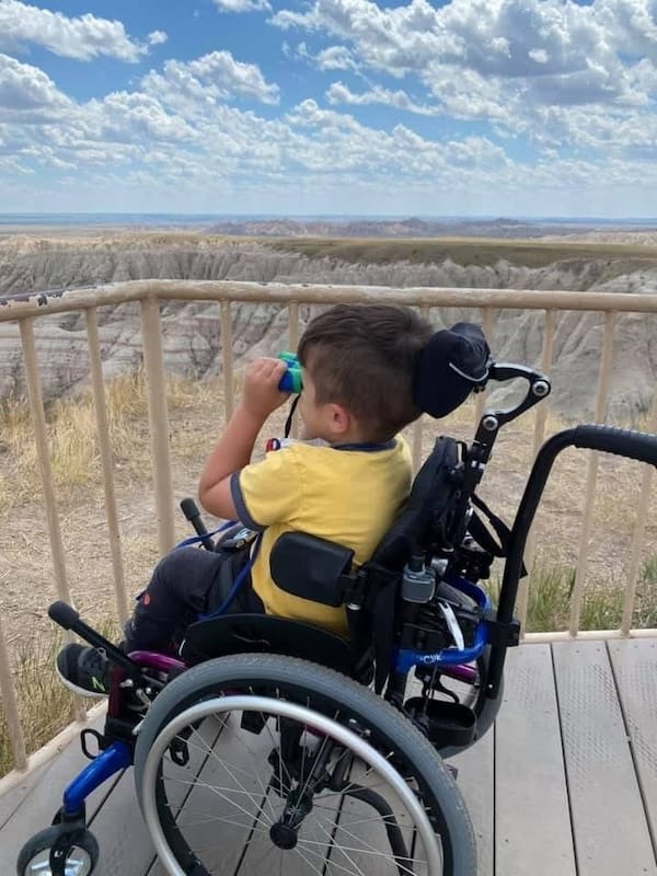 Jackson in his wheelchair, enjoying nature.