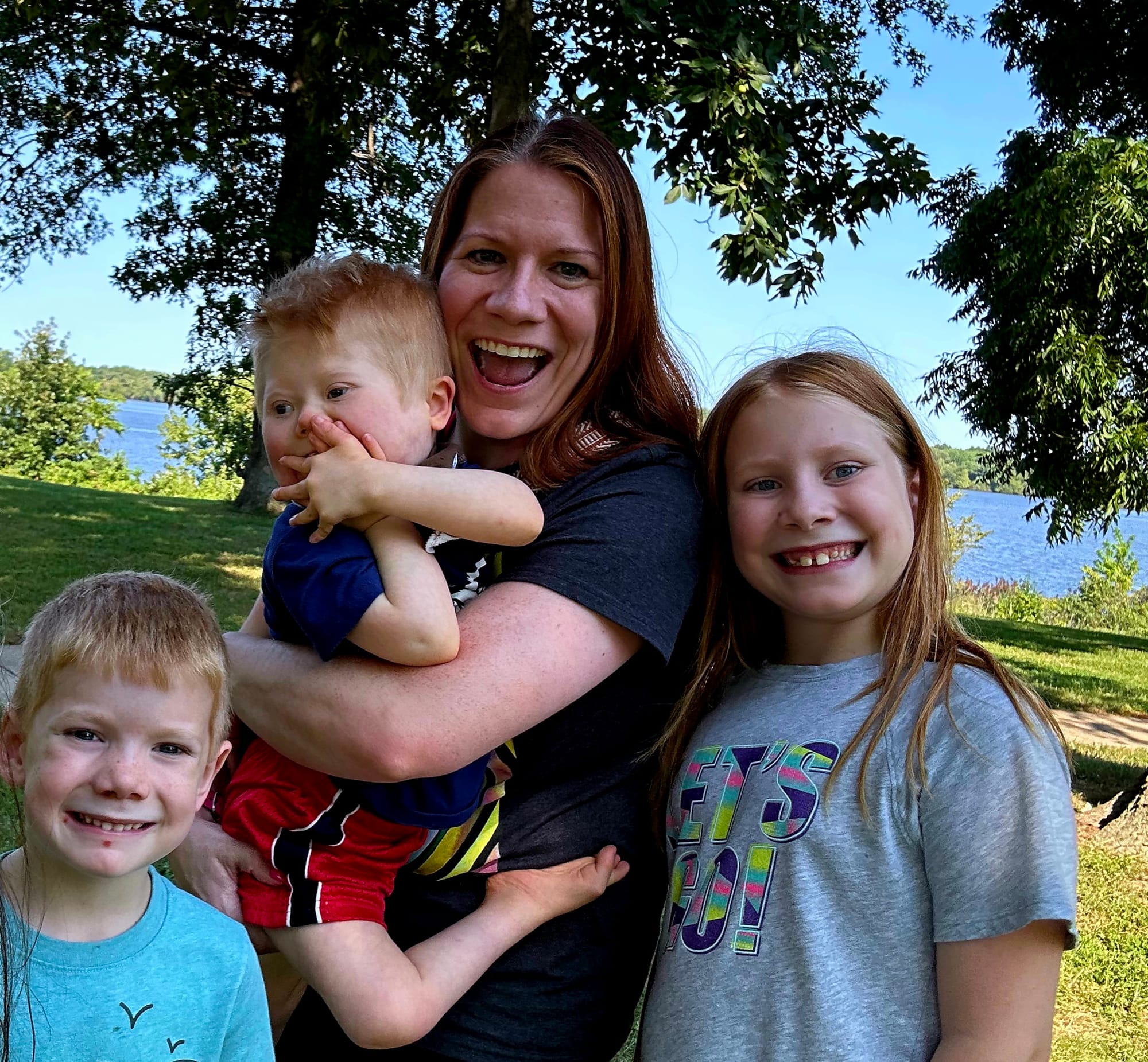 Teresa, Charla, Anthony, and Alex enjoying a beautiful day at the lake.