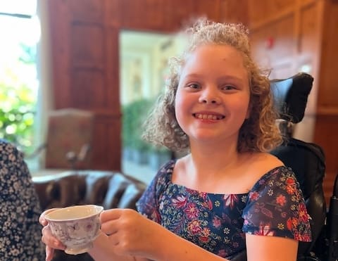 Vivian drinking tea